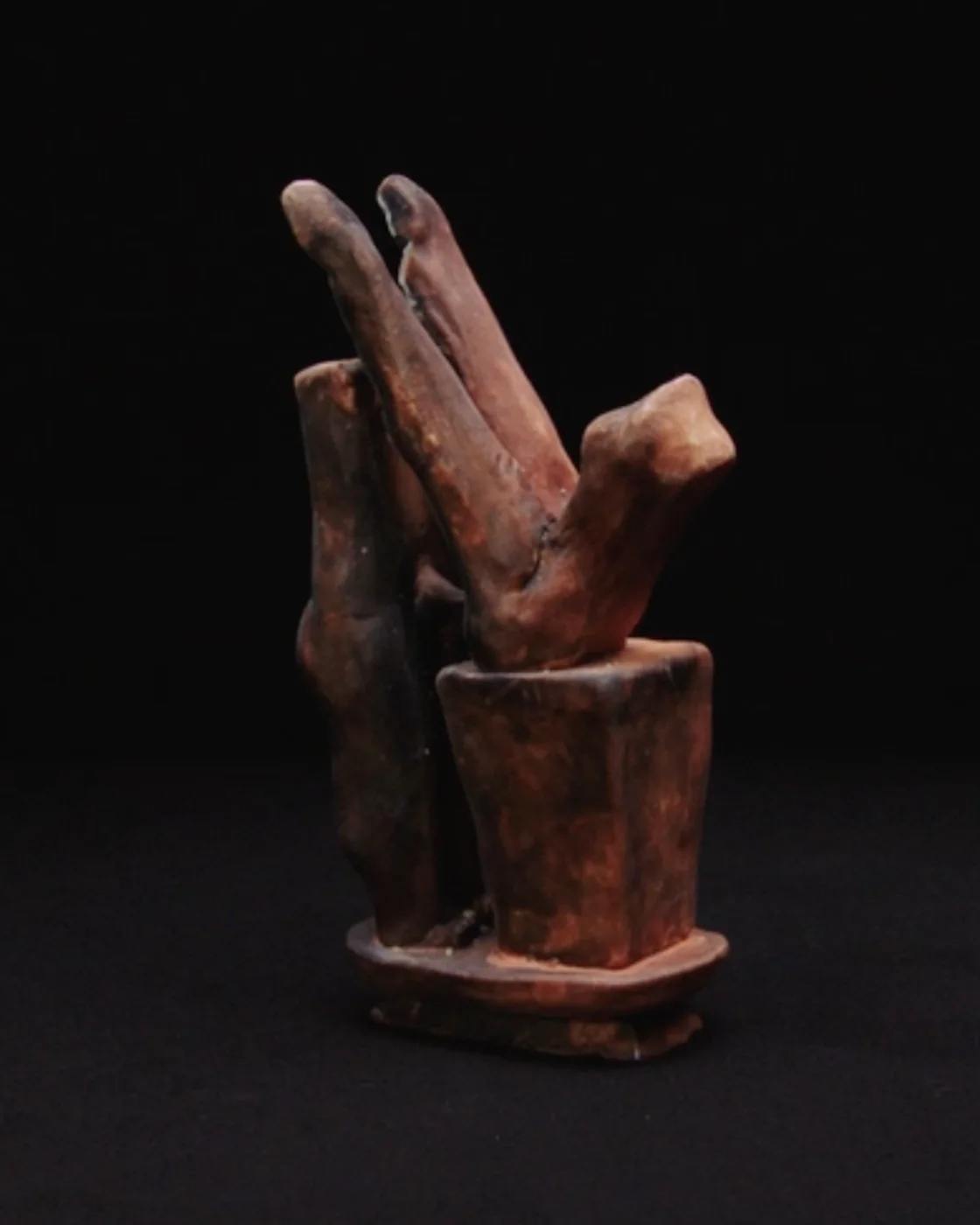 Stolen Sculpture, lit against black